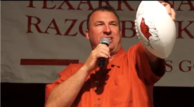 Coach Bielema auctioning a football - Mimi Campbell McDaniel/Townsquare Media Coach Bielema auctioning a football - Mimi Campbell McDaniel/Townsquare Media